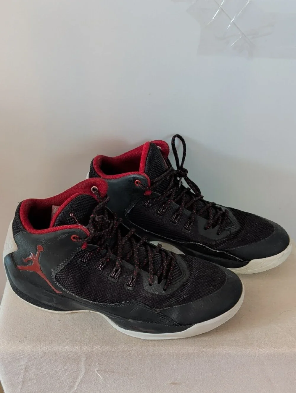 Jordan Men’s Black and Red High-Top Athletic Basketball Shoes.